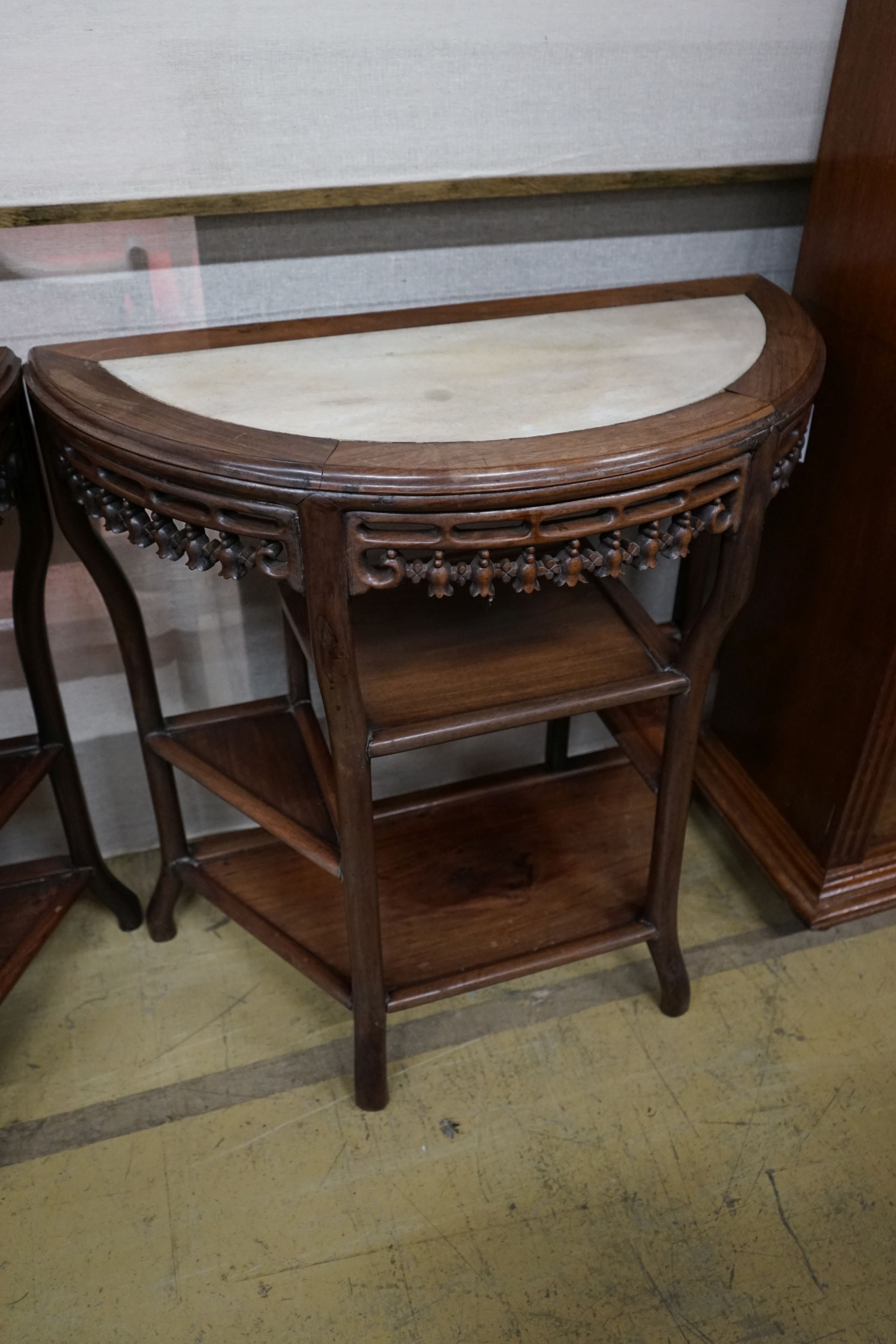 A pair of Chinese marble-topped demi lune console tables, width 82cm, depth 40cm, height 80cm